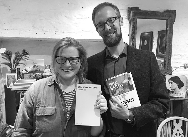 SARAH CAVE AND BEN SMITH HOLDING BOOKS